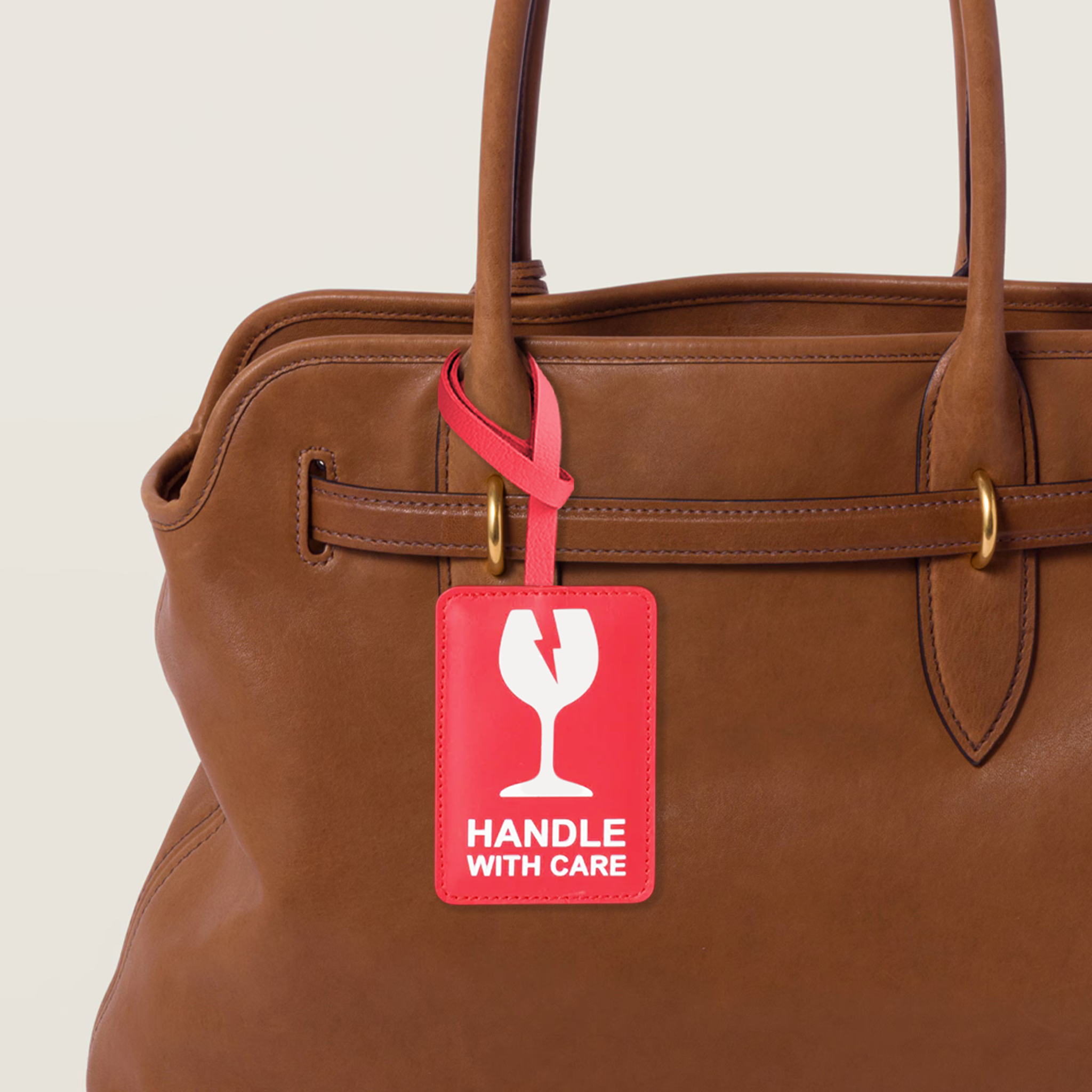 HANDLE WITH CARE BAG CHARM